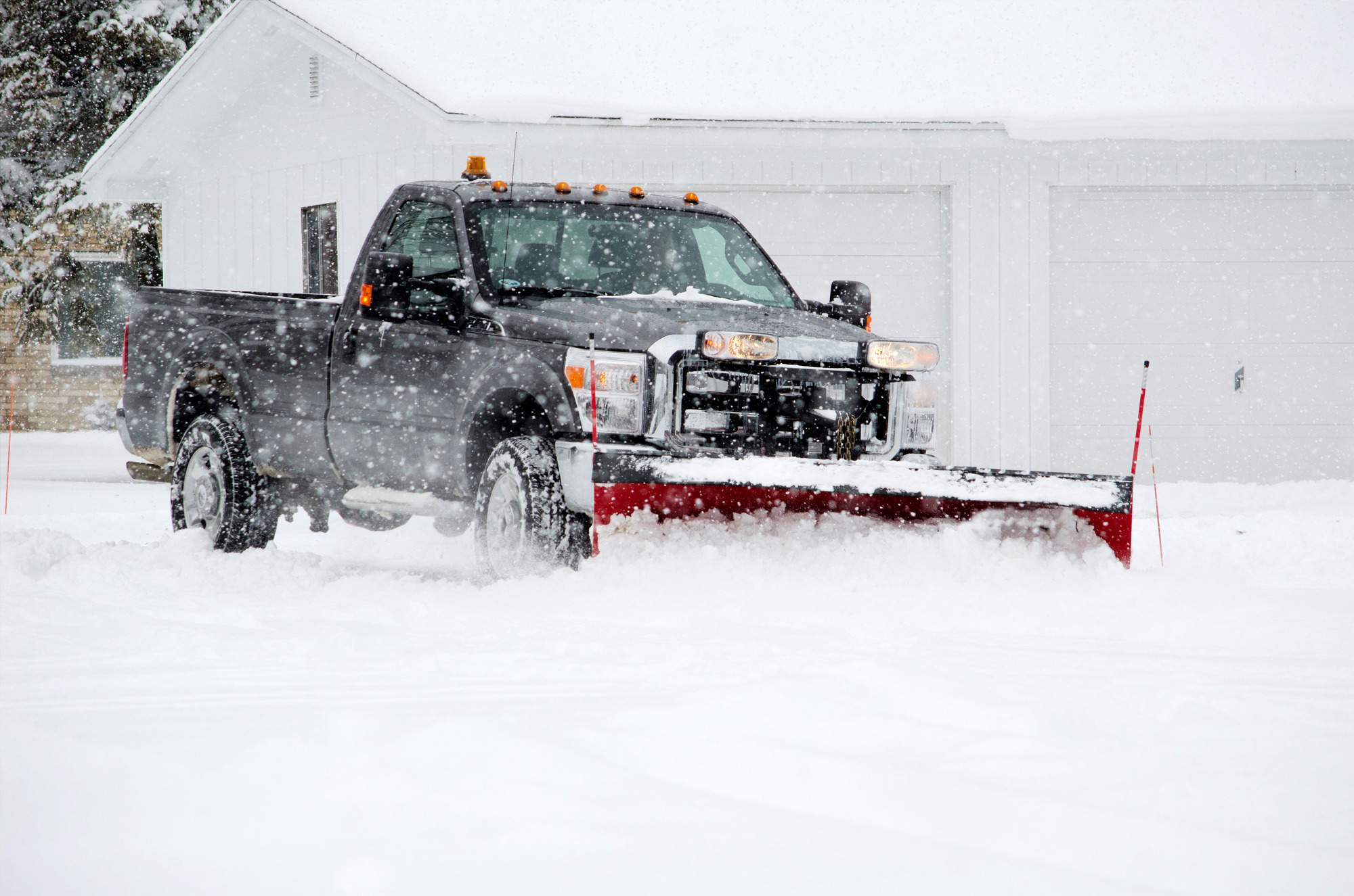 A truck snow plowing in Utah